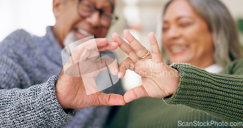 Image of Smile, heart hands or old couple with support, love or hope in a marriage commitment at home together. Happy, valentines day blur or romantic senior man with trust or elderly woman on anniversary