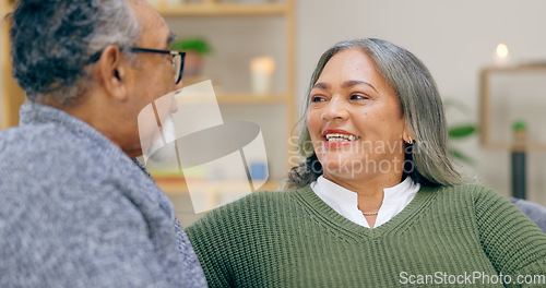 Image of Senior couple, smile and conversation in home living room, love and bonding together to relax. Happy elderly man, woman in lounge and connection, healthy relationship and care in retirement in house