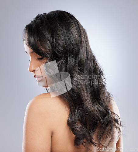 Image of Dark hair shades is like precious gemstones. Rearview shot of a young woman with healthy brown hair.