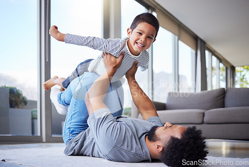 Image of Every day is fun with dad. a young father playing with his son at home.