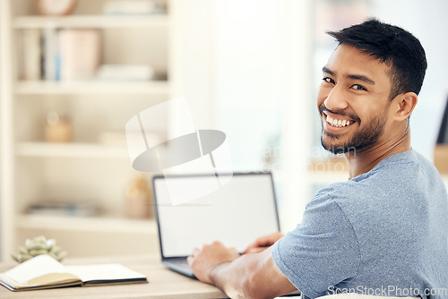 Image of Todays a good day to get work done. a young businessman using a laptop in an office at work.