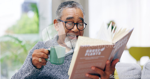 Image of Elderly man, book and coffee on sofa with smile, reading or relax in retirement in home living room. Senior african person, literature and happy with tea for knowledge, thinking and drink on couch