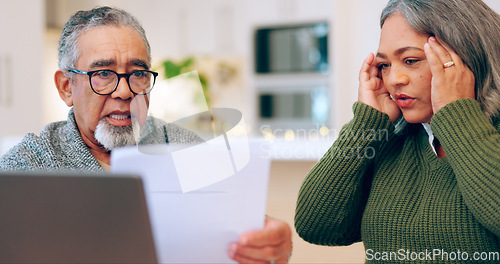 Image of Senior couple, stress and documents for tax, debt and bills, bankruptcy or retirement. Elderly man, woman and paperwork in financial crisis, planning budget or asset management in living room at home