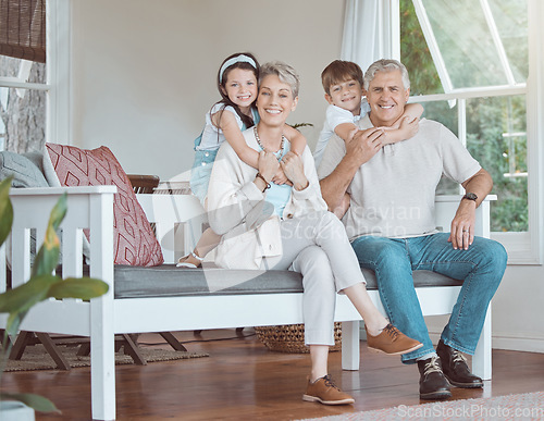 Image of Let love be your energy. grandparents bonding with their grandkids on the sofa at home.