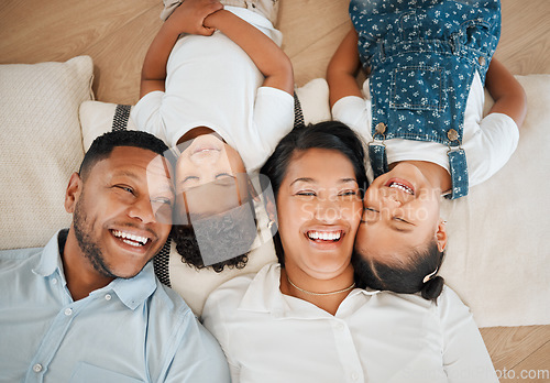 Image of In family life, love is the oil that eases friction. a family laying on the floor at home.