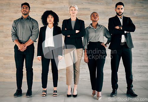 Image of Dont be afraid to give your best. a group of businesspeople standing with their arms crossed in an office at work.