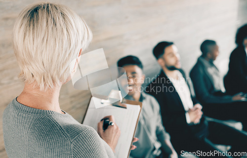 Image of Good work has become a habit. a group of new employees having a discussion with the recruiter at an office.