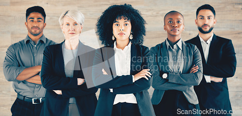 Image of Learn from the mistakes of others. a group of businesspeople standing with their arms crossed in an office at work.