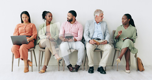 Image of Waiting room, recruitment and people with notebook, laptop or talking of business networking, HR opportunity and social media. Diversity, job search and Human Resources group of men or women in chair