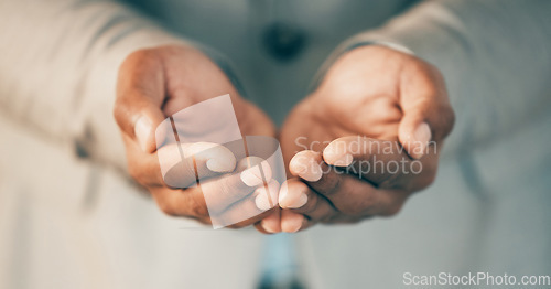 Image of Always make time to help others. an unrecognizable businessperson cupping their hands at work.