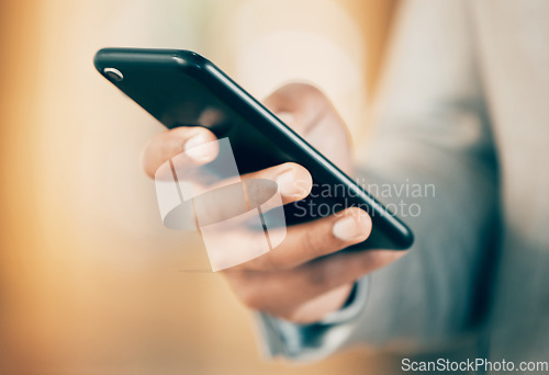 Image of Networking made easier. an unrecognizable businessperson using a phone at work.