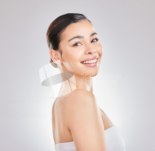 Image of Show off that smile. a young woman posing against a grey background.