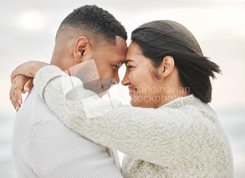 Image of Lovers and friends. an affectionate young couple sharing an intimate moment on the beach.