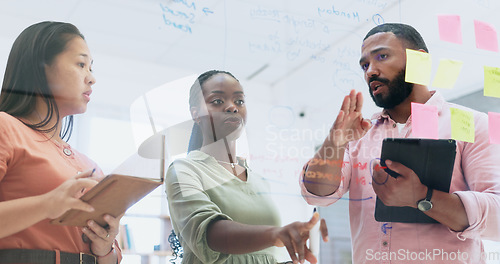 Image of Business people, teamwork and meeting for schedule planning, sticky notes or strategy on glass board at office. Group of employees in team brainstorming, ideas or reminder for agenda together