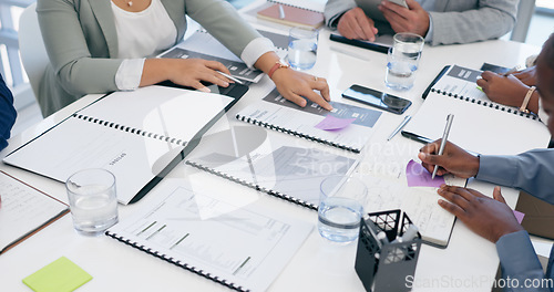 Image of Business people, hands and writing with documents in planning, schedule or meeting on office table. Closeup of employee group with paperwork for tasks, strategy or brainstorming ideas at workplace