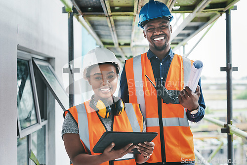 Image of Technology touches almost every aspect of our operations. Portrait of a young man and woman working at a construction site.