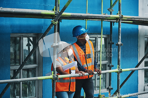 Image of Ensuring the site satisfies the project standards and specifications. a young man and woman working at a construction site.