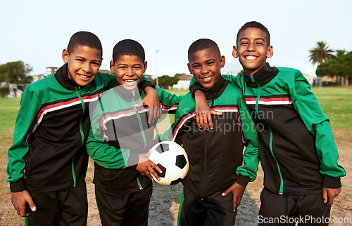 Image of Soccer teaches kids skills such as teamwork and perseverance. Portrait of a boys soccer team standing together on a sports field.