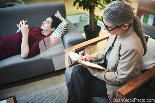 Image of If it gives you grief, get it off your chest. a young man having a therapeutic session with a psychologist.