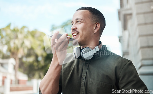 Image of The guy everyone wants to connect with. a young businessman using a smartphone against an urban background.