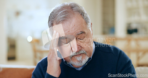 Image of Senior man, headache and stress in mistake, financial crisis or retirement debt on living room sofa at home. Mature male person with migraine, anxiety or depression in loss or mental health at house