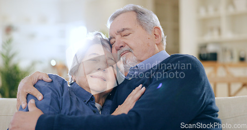 Image of Home, hug and senior couple on a couch, love and happiness with relationship in a living room. Romance, old man and elderly woman on a sofa, support and funny with embrace, retirement and marriage