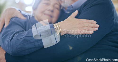 Image of Home, hug and senior couple on a sofa, love and happiness with retirement in a living room. Romance, old man and elderly woman on a couch, support and embrace with anniversary, romantic and cheerful