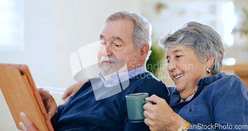 Image of Tablet, tea and a senior couple in their home to relax together during retirement for happy bonding. Tech, smile or love with an elderly man and woman drinking coffee in their apartment living room