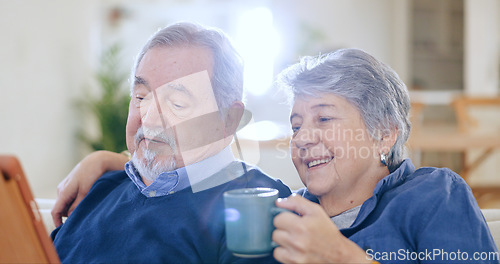 Image of Tablet, coffee and smile with an old couple in their home to relax together during retirement for happy bonding. Tech, love or romance with a senior man and woman drinking tea in their living room