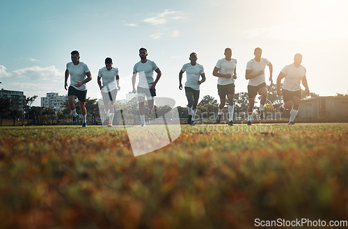 Image of Come with confidence and leave as champions. Rearview shot of a group of young rugby players running on a field.
