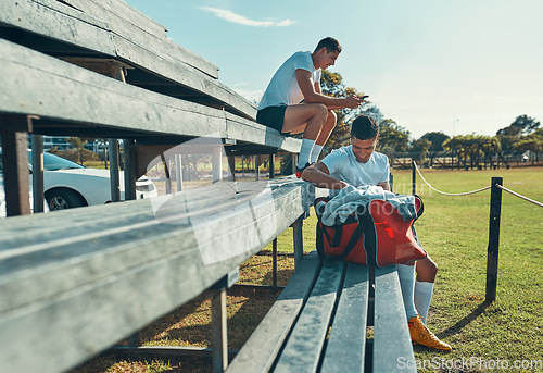 Image of He always come to practice with a positive attitude. two rugby players sitting on a bench.