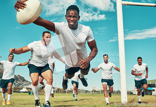 Image of Not all heroes wear capes. a rugby player scoring a try while playing on a field.