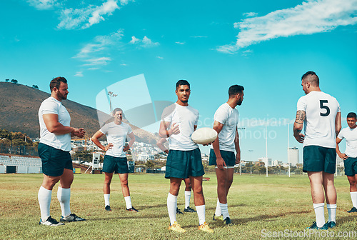 Image of Getting ready for a brand new season. Rearview shot of a group of young rugby players standing on a field.