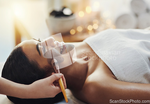 Image of Well give you the full royal treatment. a young woman getting a facial treatment at a spa.