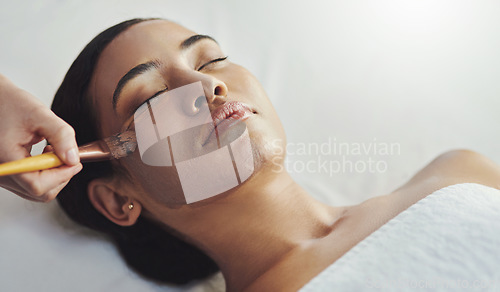 Image of Your complexion will be flawless after this. a young woman getting a facial treatment at a spa.