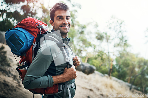 Image of Its been an adventure indeed. Portrait of a carefree young man going for a hike up a mountain outside during the day.