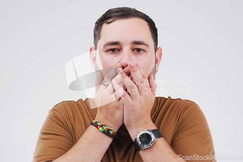 Image of Are you kidding. Studio shot of a young man looking shocked against a grey background.