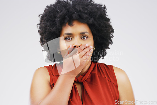 Image of Oh no. Studio shot of a young woman looking shocked against a grey background.