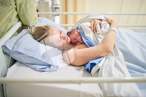 Image of Ill cherish this moment forever. a beautiful young mother lying in bed with her newly born baby girl in the hospital.