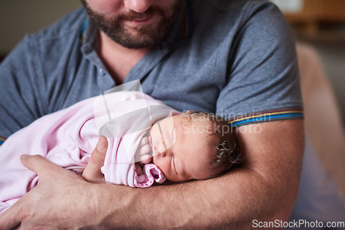 Image of Shes captured my heart. an adorable infant girl sleeping in her fathers arms in hospital.