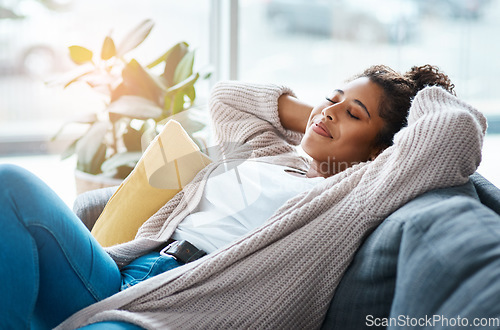 Image of Home has never felt so comfortable. an attractive young woman relaxing on her couch at home.