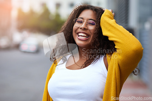 Image of Being me makes me so happy. Cropped portrait of a happy young woman standing outdoors in an urban setting.