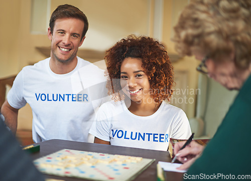 Image of Volunteering is so rewarding. Portrait of volunteers working with seniors at a retirement home.