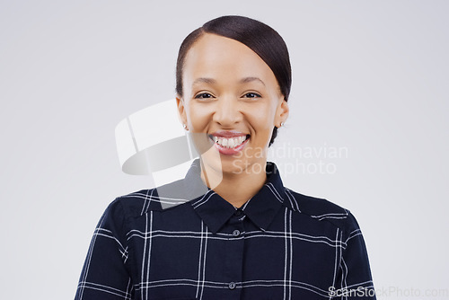 Image of I dont need a reason to smile. Studio portrait of an attractive young woman smiling against a grey background.