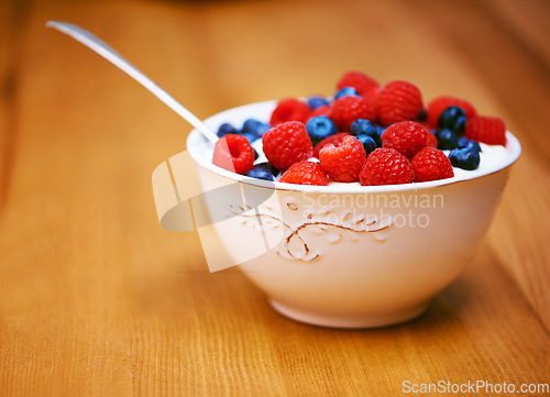 Image of Starting the day well. a delicious bowl of berries and yoghurt.