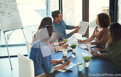 Image of Well be fine as long as we stay within budget. a group of businesspeople having a meeting in an office.