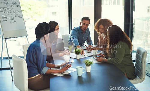 Image of This could be a risk worth taking. a group of businesspeople having a meeting in an office.