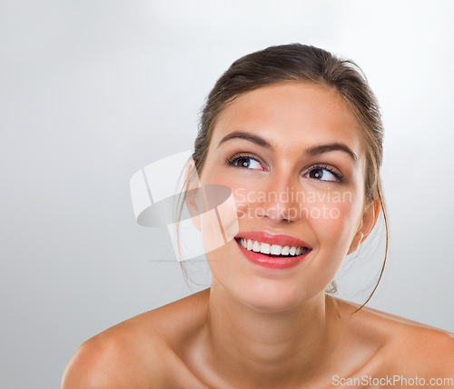 Image of Letting her mind wonder about the secrets of skincare. a gorgeous young woman posing in the studio.