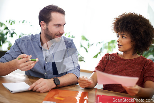 Image of He has a passion for this business. two design professionals having a discussion while seated at a table.