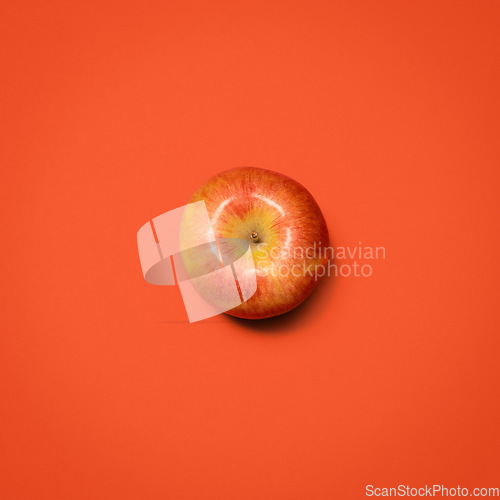 Image of What nature gives us. a red apple against an empty studio background.